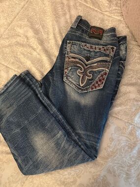 Rock Revival Women's Blue Boot Cut Jeans with Embroidered Pockets